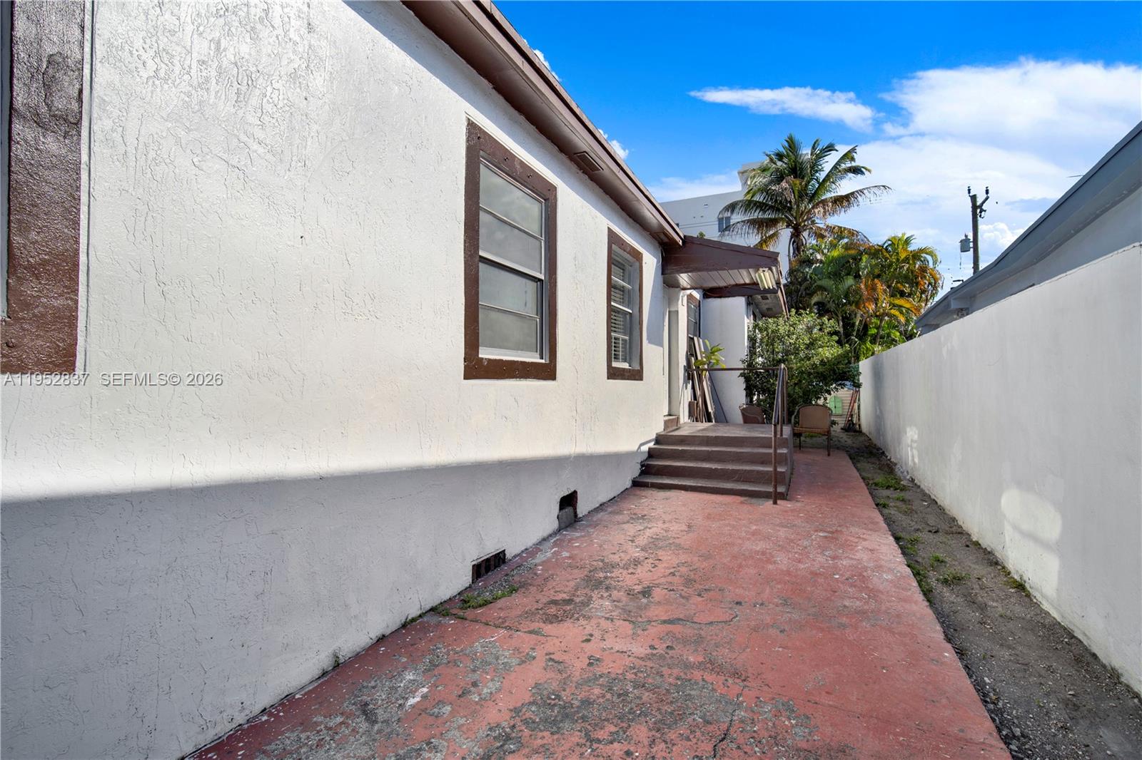 474 East 10th Street Hialeah, FL 33010 - Photo 32 of 38 a front view of a house with a yard