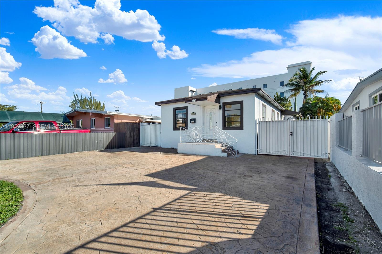 474 East 10th Street Hialeah, FL 33010 - Photo 34 of 38 a view of a house with a backyard