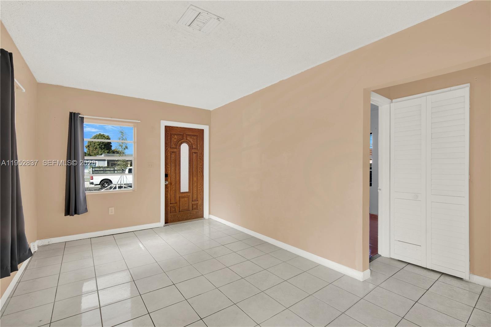 474 East 10th Street Hialeah, FL 33010 - Photo 7 of 38 a view of an empty room with window