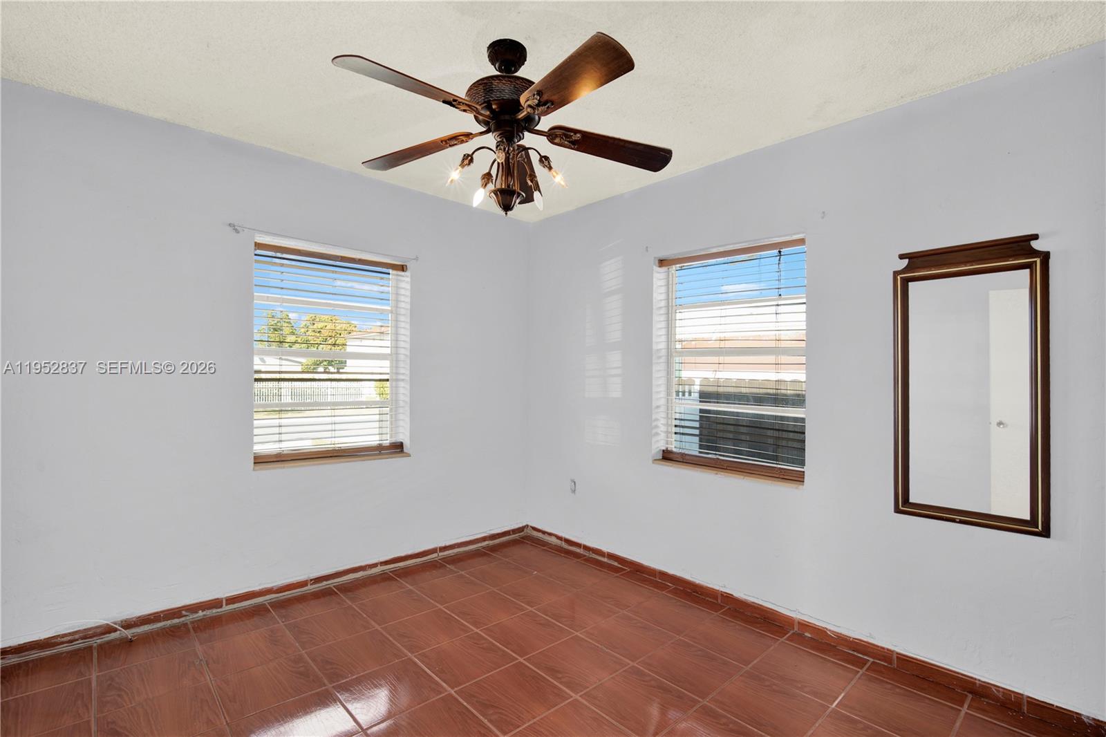 474 East 10th Street Hialeah, FL 33010 - Photo 8 of 38 a view of an empty room with a window