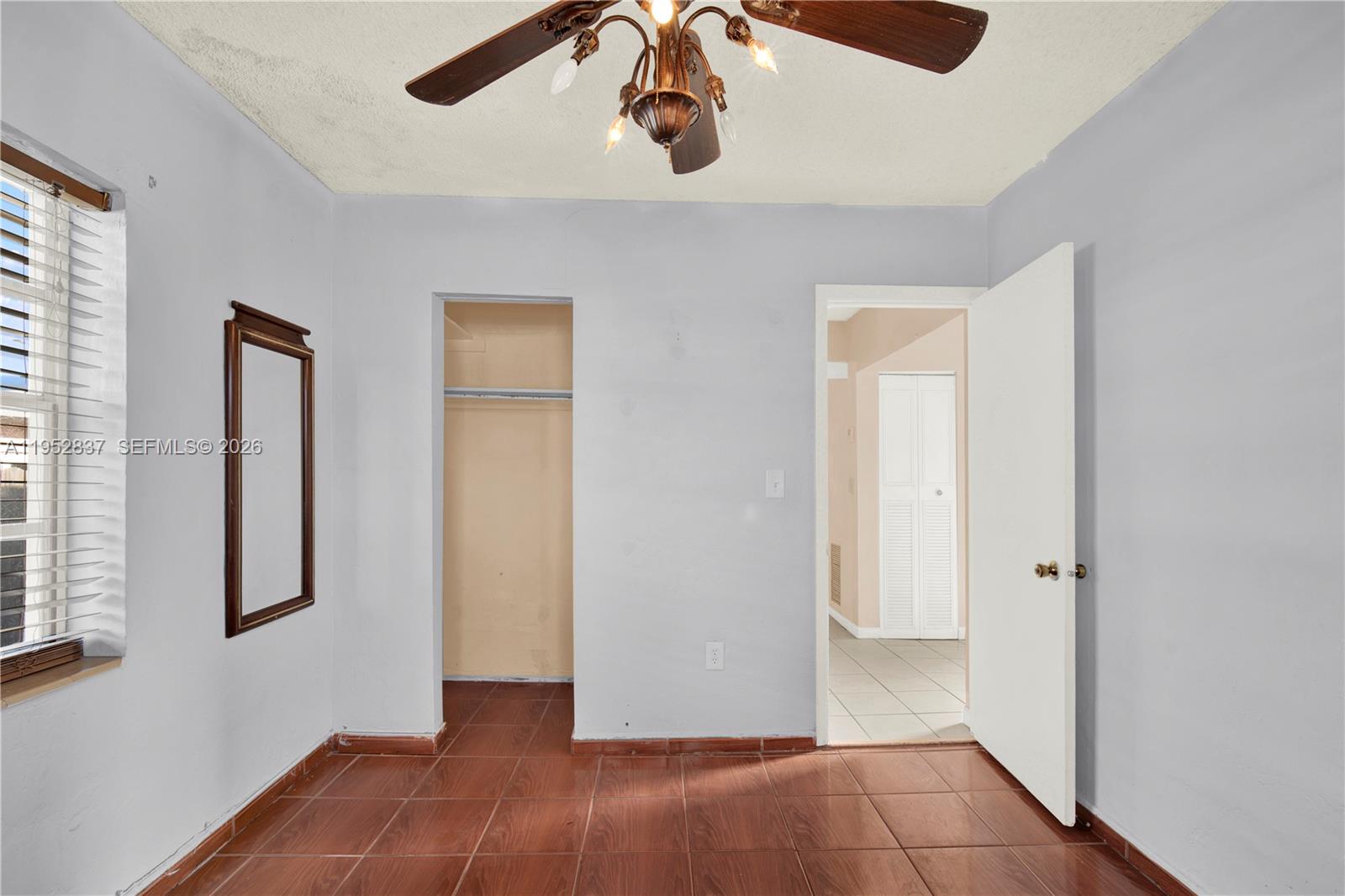 474 East 10th Street Hialeah, FL 33010 - Photo 9 of 38 an empty room with windows