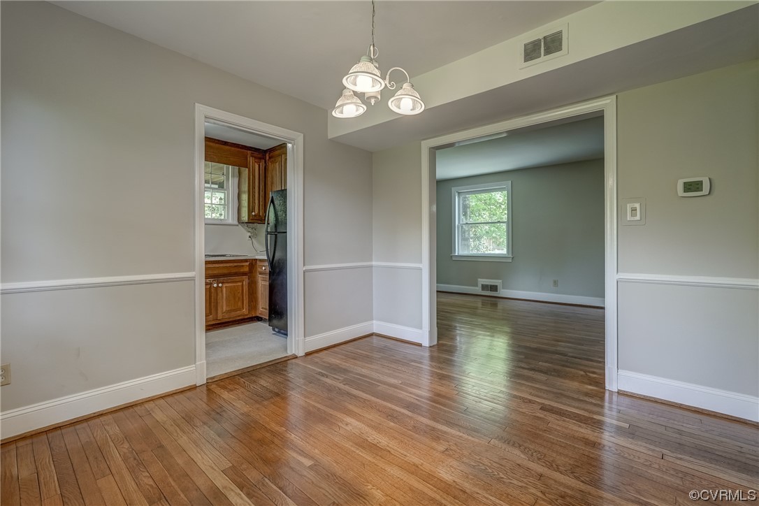 1802 Bremo Road Richmond, VA 23226 - Photo 11 of 50 wooden floor in an empty room with a window