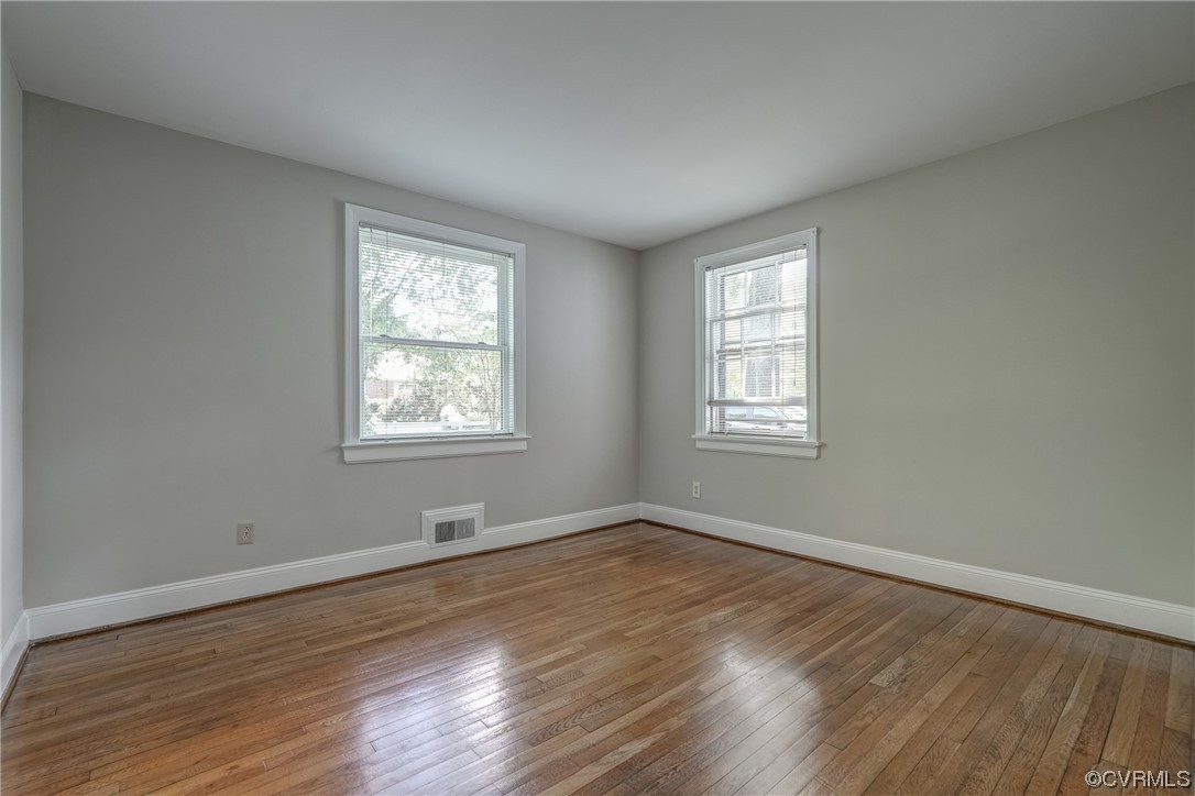 1802 Bremo Road Richmond, VA 23226 - Photo 19 of 50 a view of an empty room with wooden floor and a window