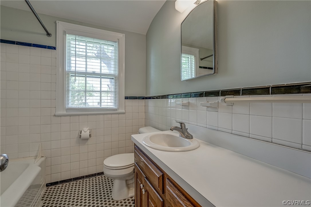 1802 Bremo Road Richmond, VA 23226 - Photo 25 of 50 a bathroom with a sink a toilet and a mirror