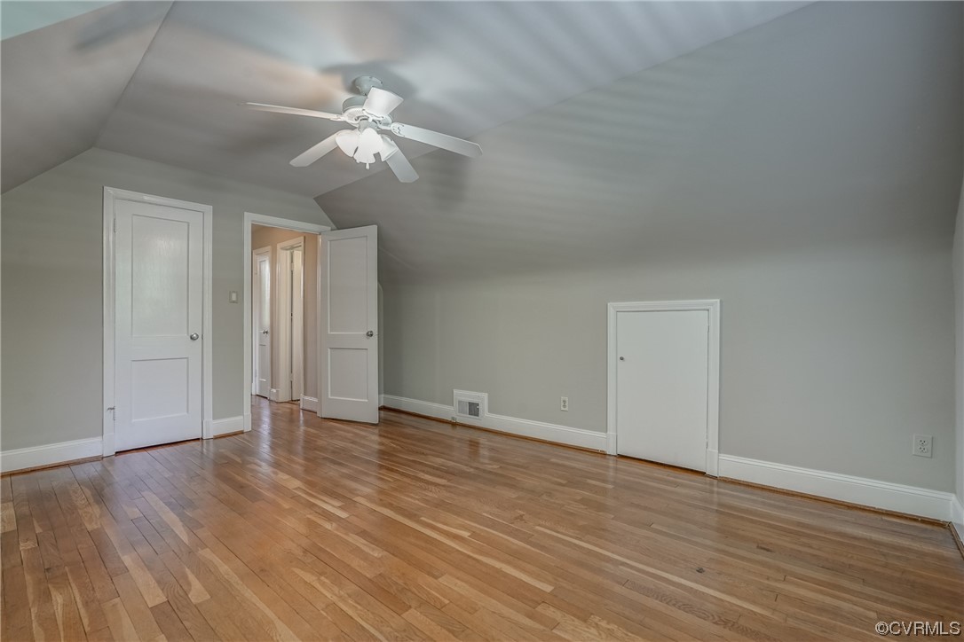 1802 Bremo Road Richmond, VA 23226 - Photo 28 of 50 a view of an empty room with wooden floor and a ceiling fan