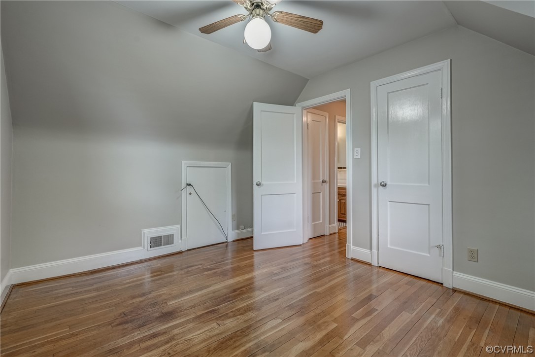 1802 Bremo Road Richmond, VA 23226 - Photo 30 of 50 a view of an empty room with wooden floor and a ceiling fan