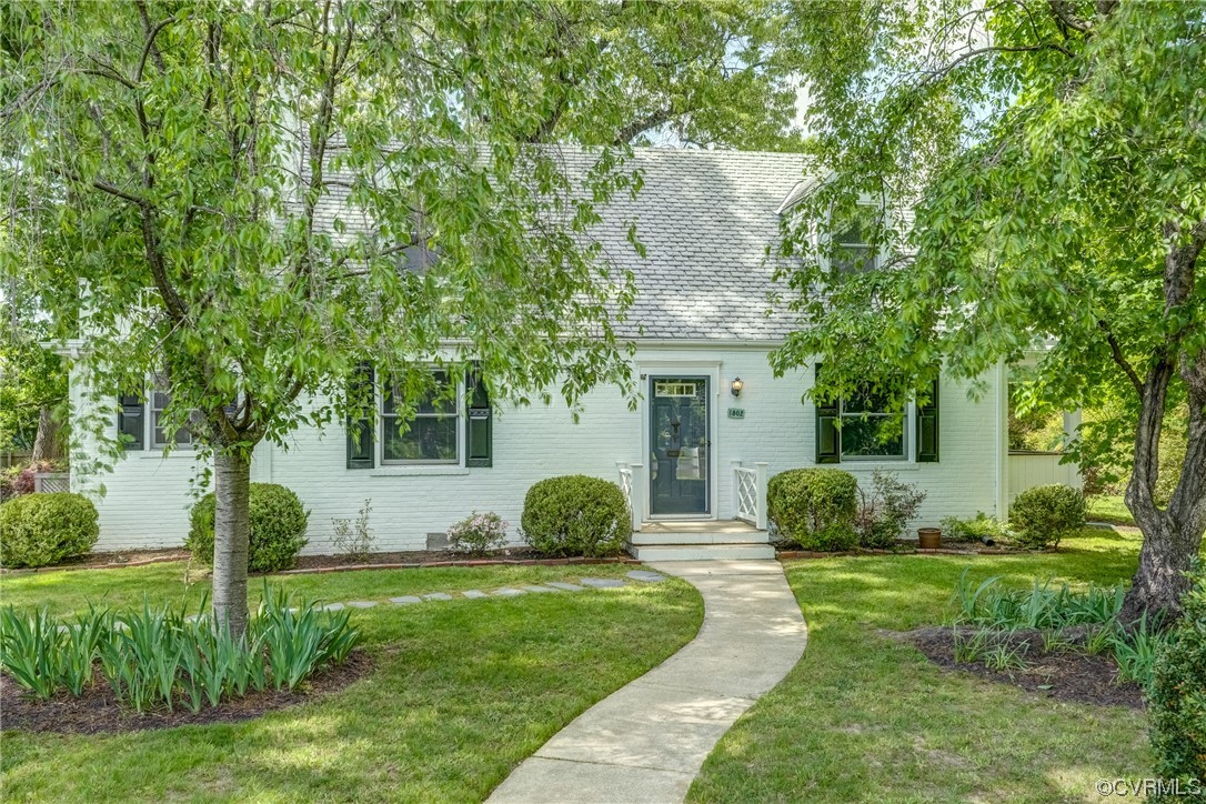 1802 Bremo Road Richmond, VA 23226 - Photo 4 of 50 a view of a house with a backyard and a tree