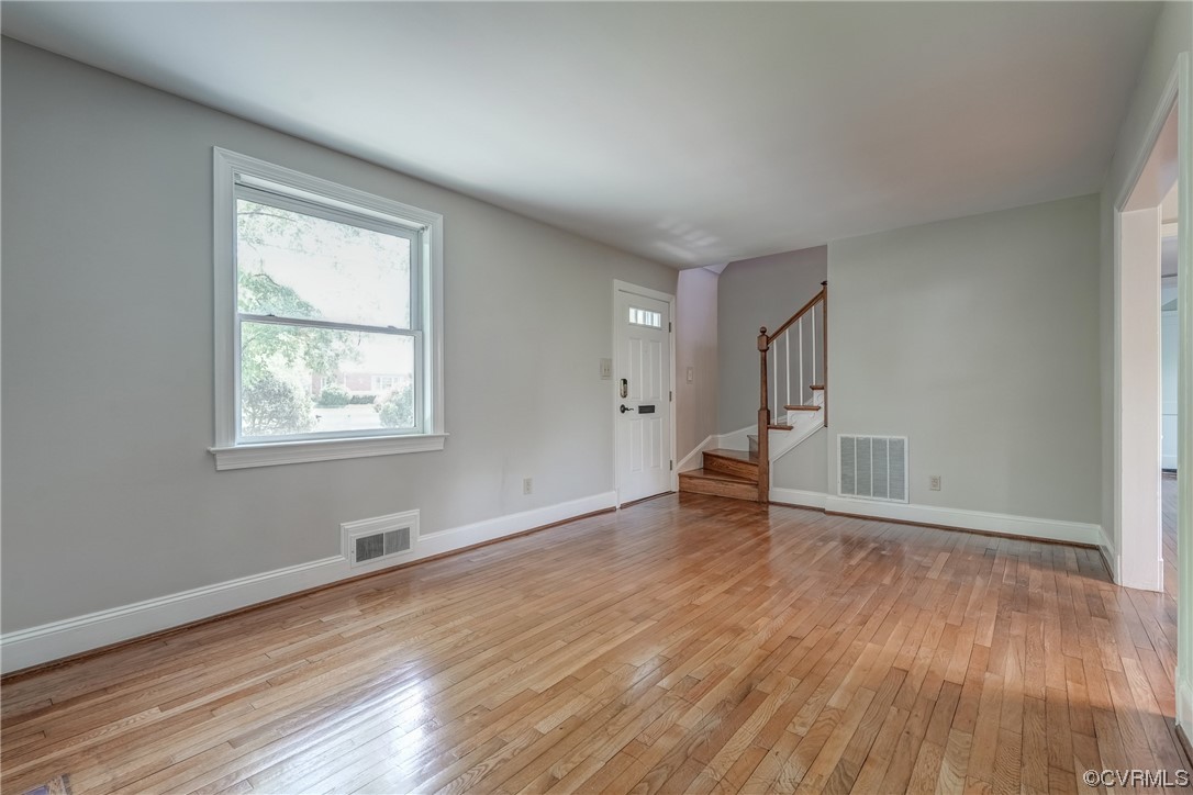 1802 Bremo Road Richmond, VA 23226 - Photo 7 of 50 an empty room with wooden floor and a window