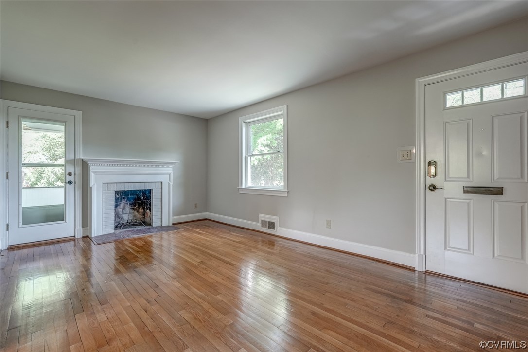1802 Bremo Road Richmond, VA 23226 - Photo 8 of 50 wooden floor fireplace and windows in an empty room
