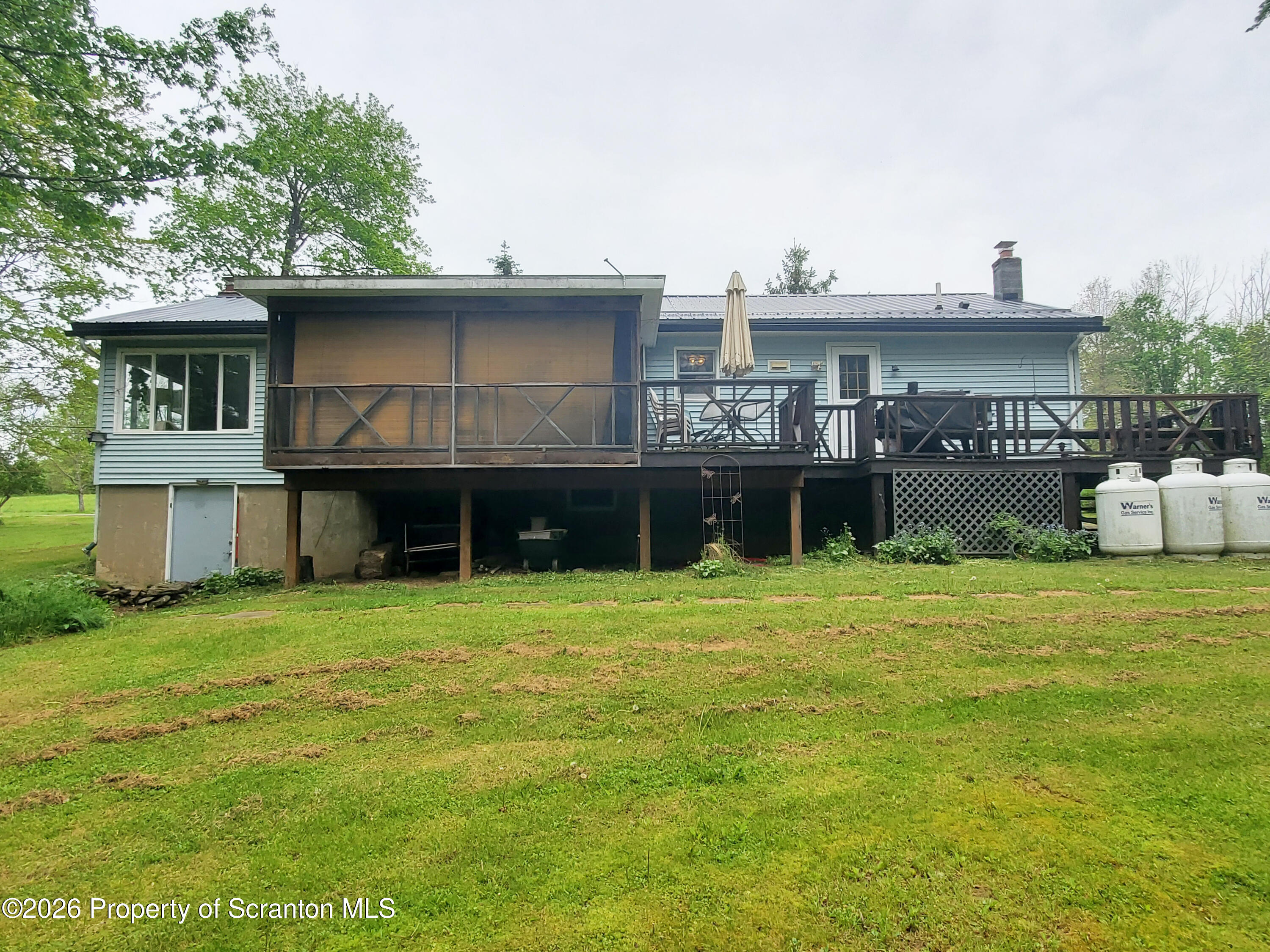 220 Brinkman Road Brackney, PA 18812 - Photo 6 of 32 a front view of a house with a yard
