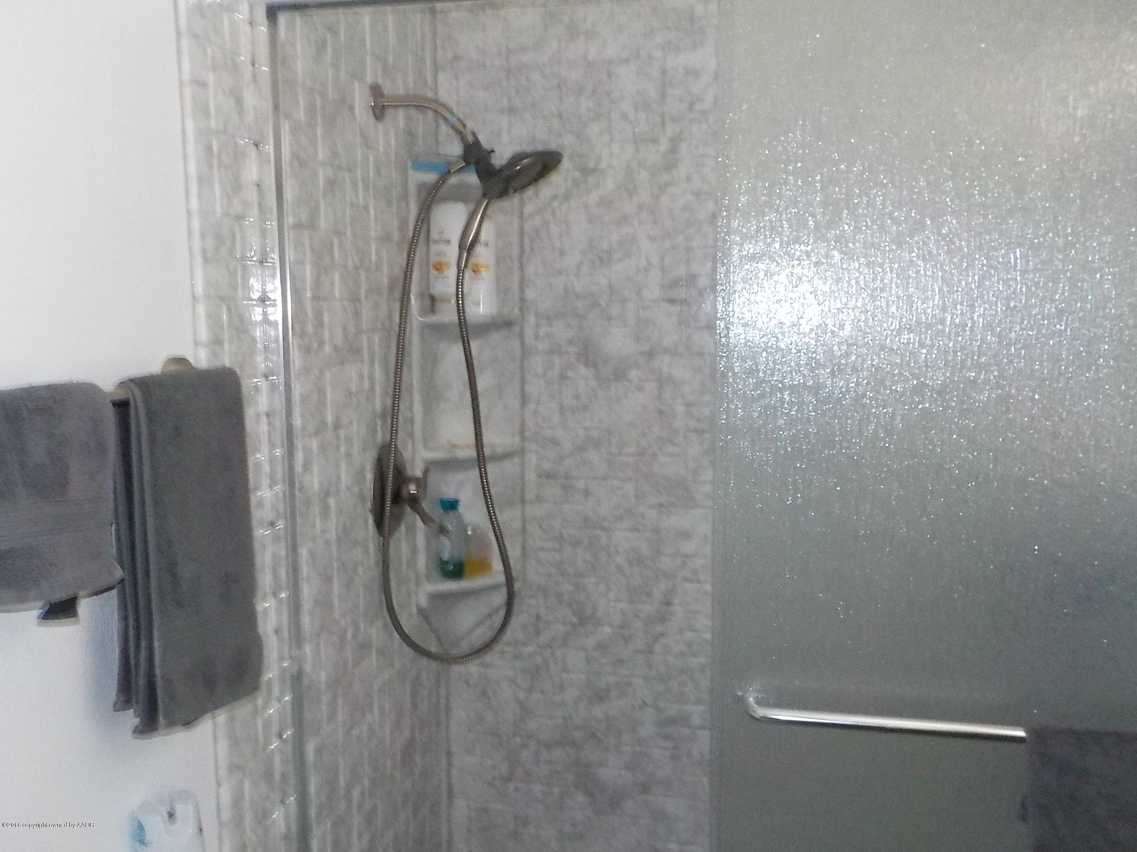 5102 Shield Drive Amarillo, TX 79110 - Photo 12 of 21 a bathroom with a shower