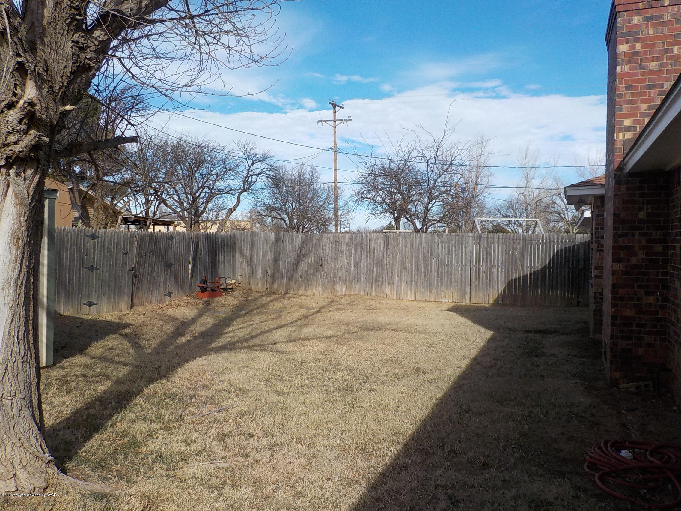 5102 Shield Drive Amarillo, TX 79110 - Photo 20 of 21 a backyard of a house with lots of green space