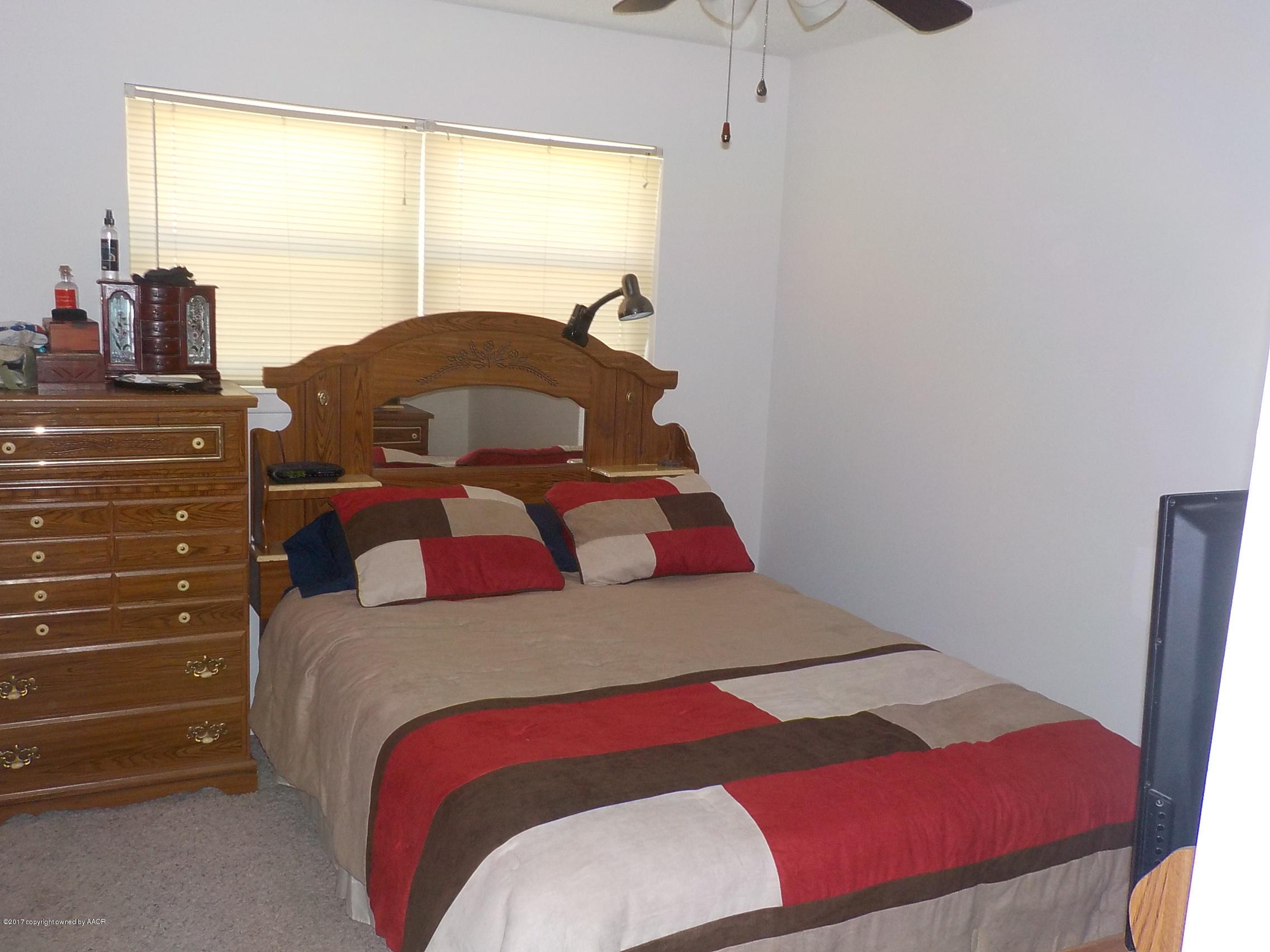 5102 Shield Drive Amarillo, TX 79110 - Photo 6 of 21 a bedroom with a bed and a window