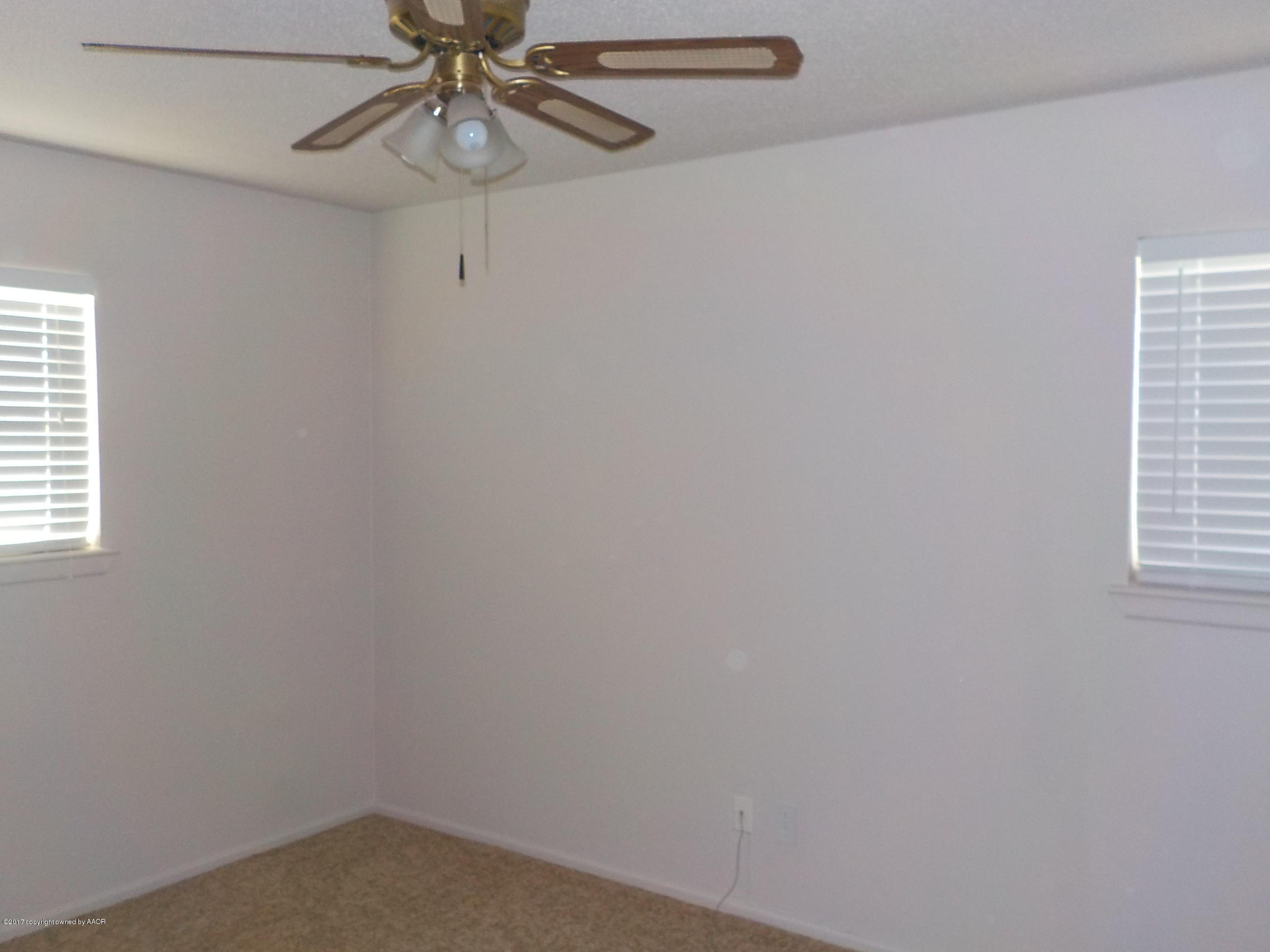 5102 Shield Drive Amarillo, TX 79110 - Photo 8 of 21 a small space with a window and a fan