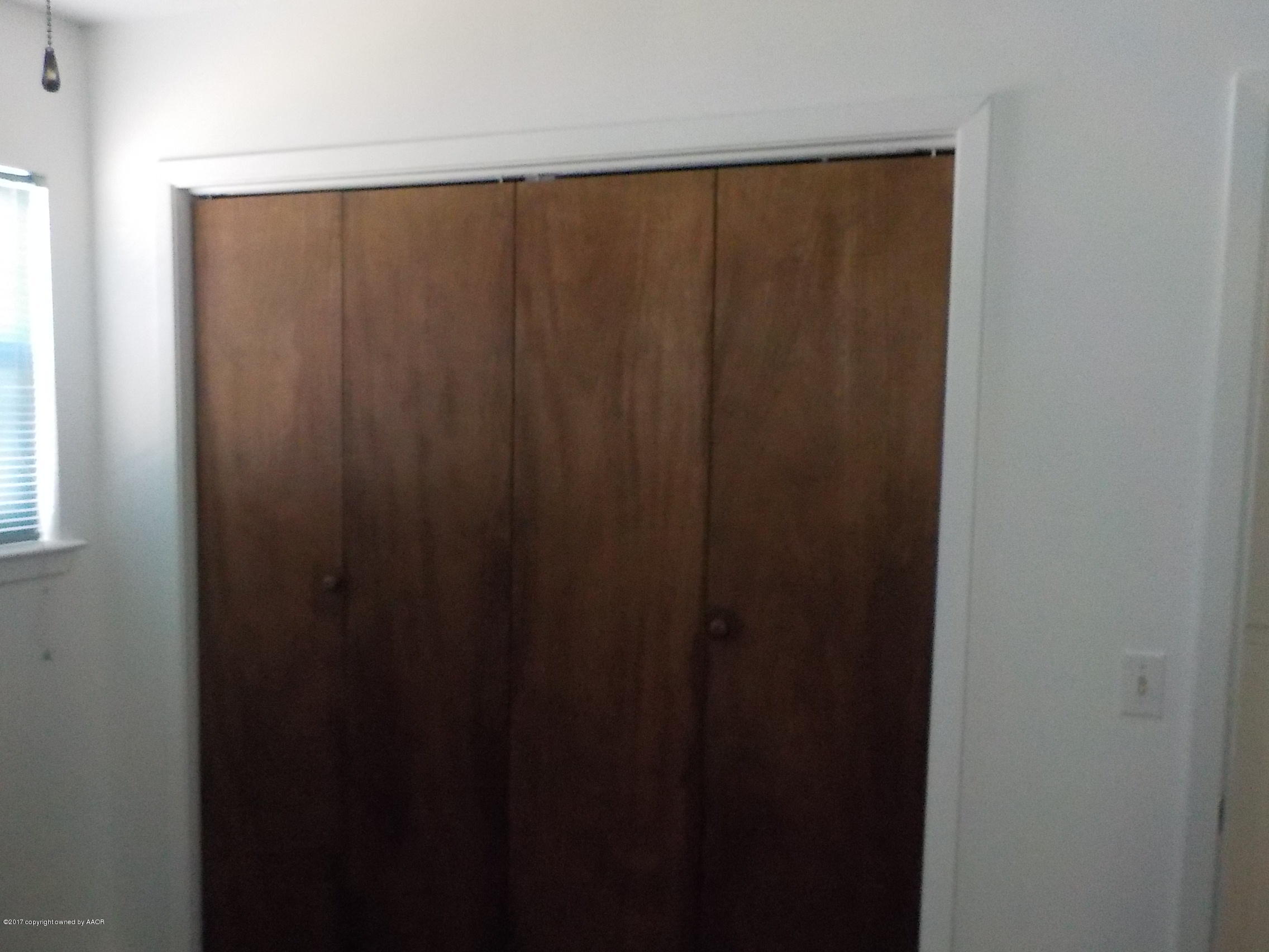 5102 Shield Drive Amarillo, TX 79110 - Photo 10 of 21 a close view of wooden door