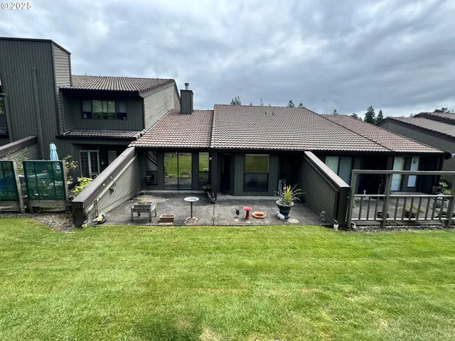 a view of house with an outdoor seating and house