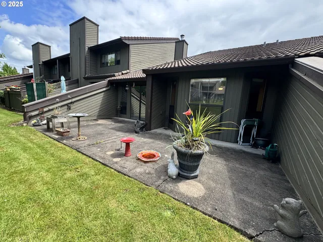 a front view of a house with outdoor seating