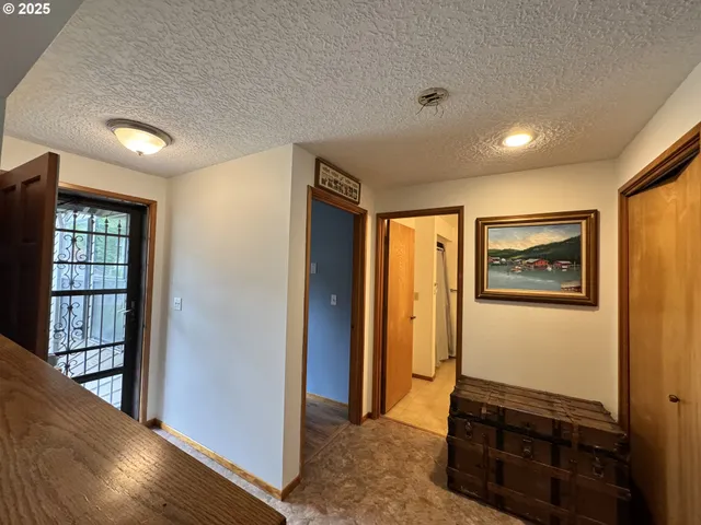 a view of a hallway with closet