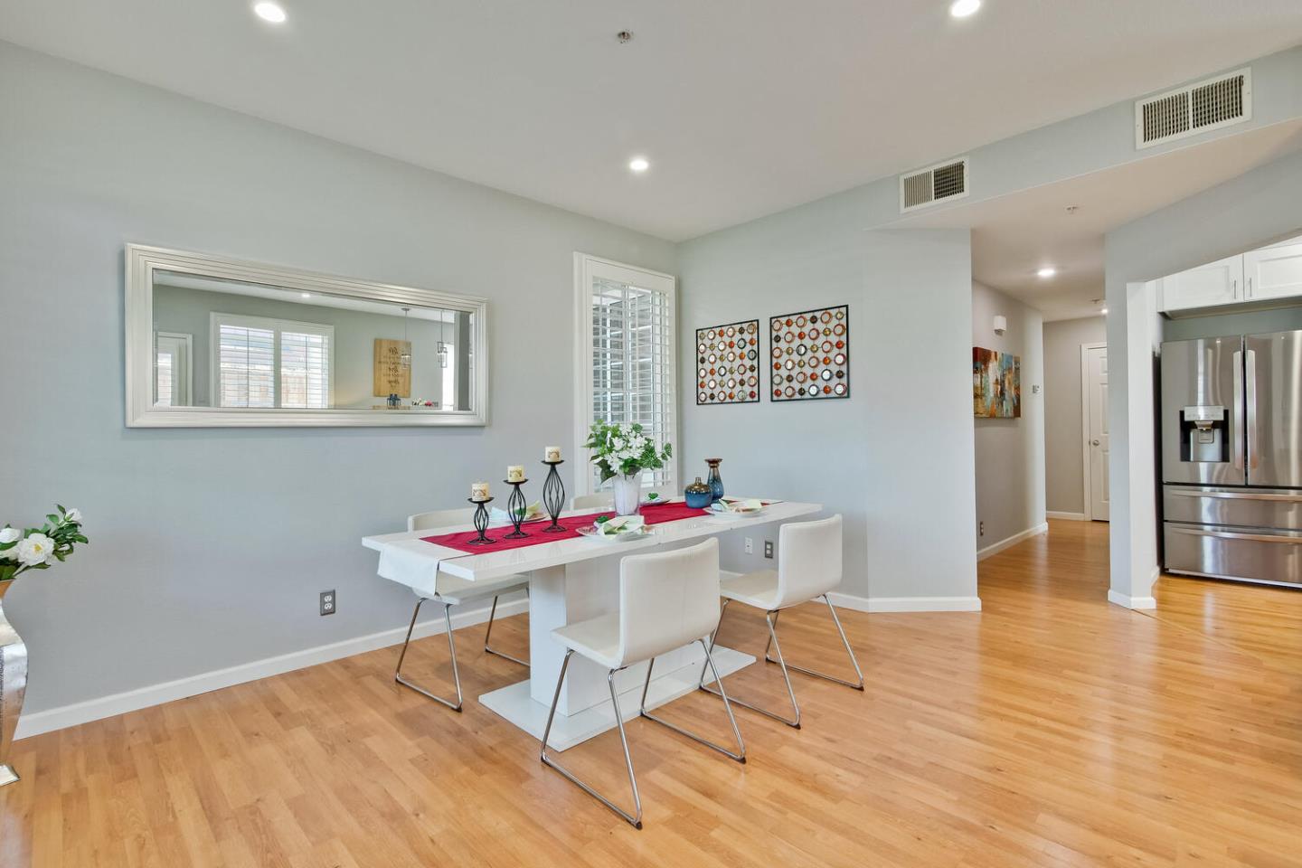 935 Old County Road, Unit 44 Belmont, CA 94002 - Photo 12 of 57 a view of a dining room with furniture and wooden floor