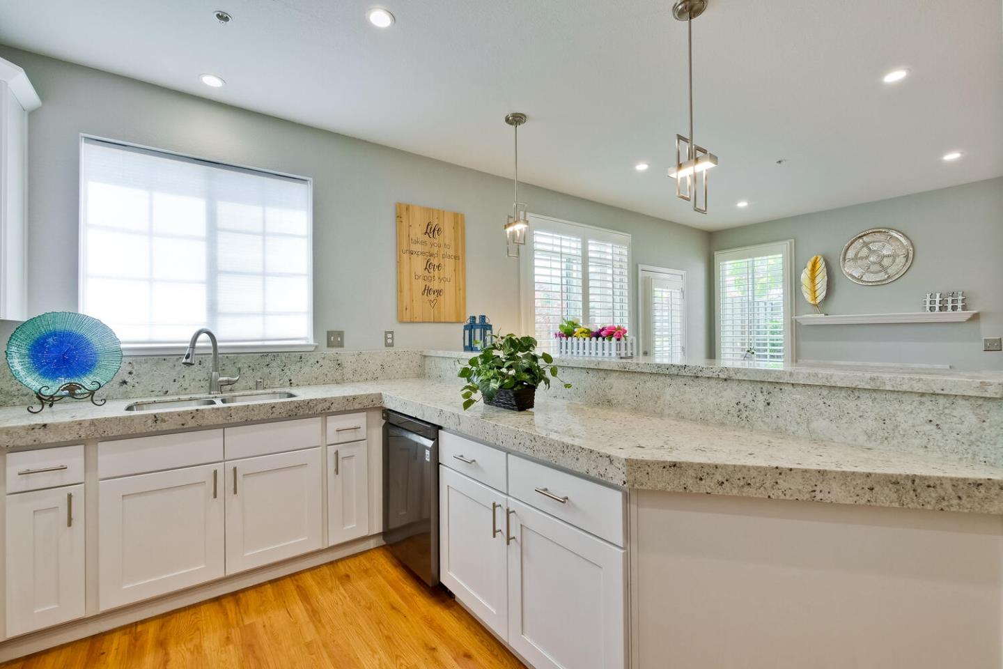 935 Old County Road, Unit 44 Belmont, CA 94002 - Photo 22 of 57 a kitchen with sink cabinets and window