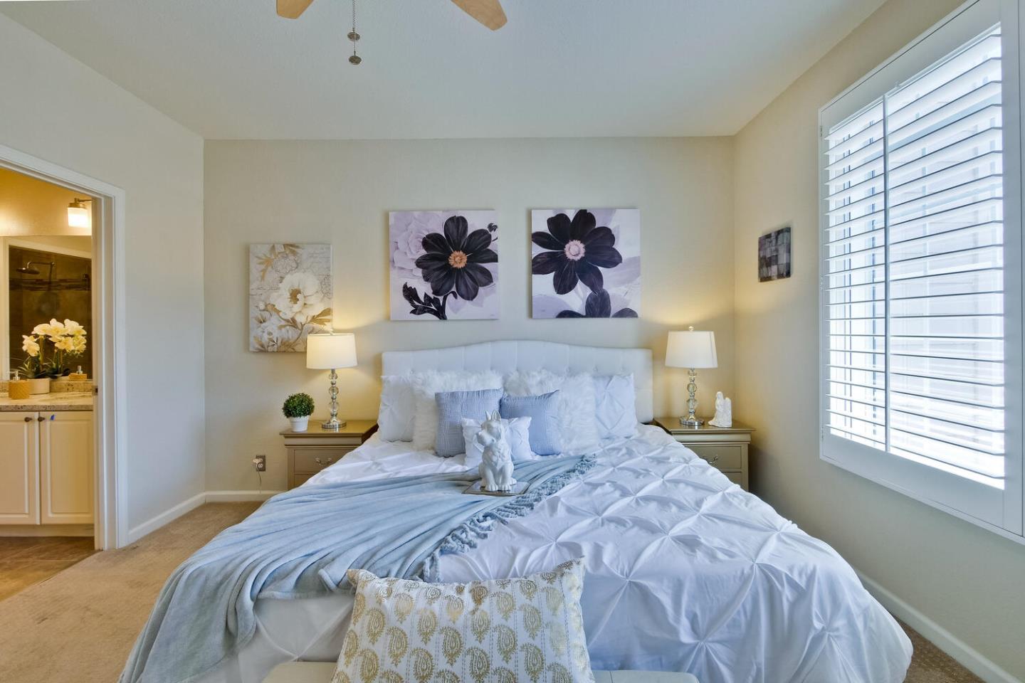 935 Old County Road, Unit 44 Belmont, CA 94002 - Photo 25 of 57 a bedroom with a bed and wall painting