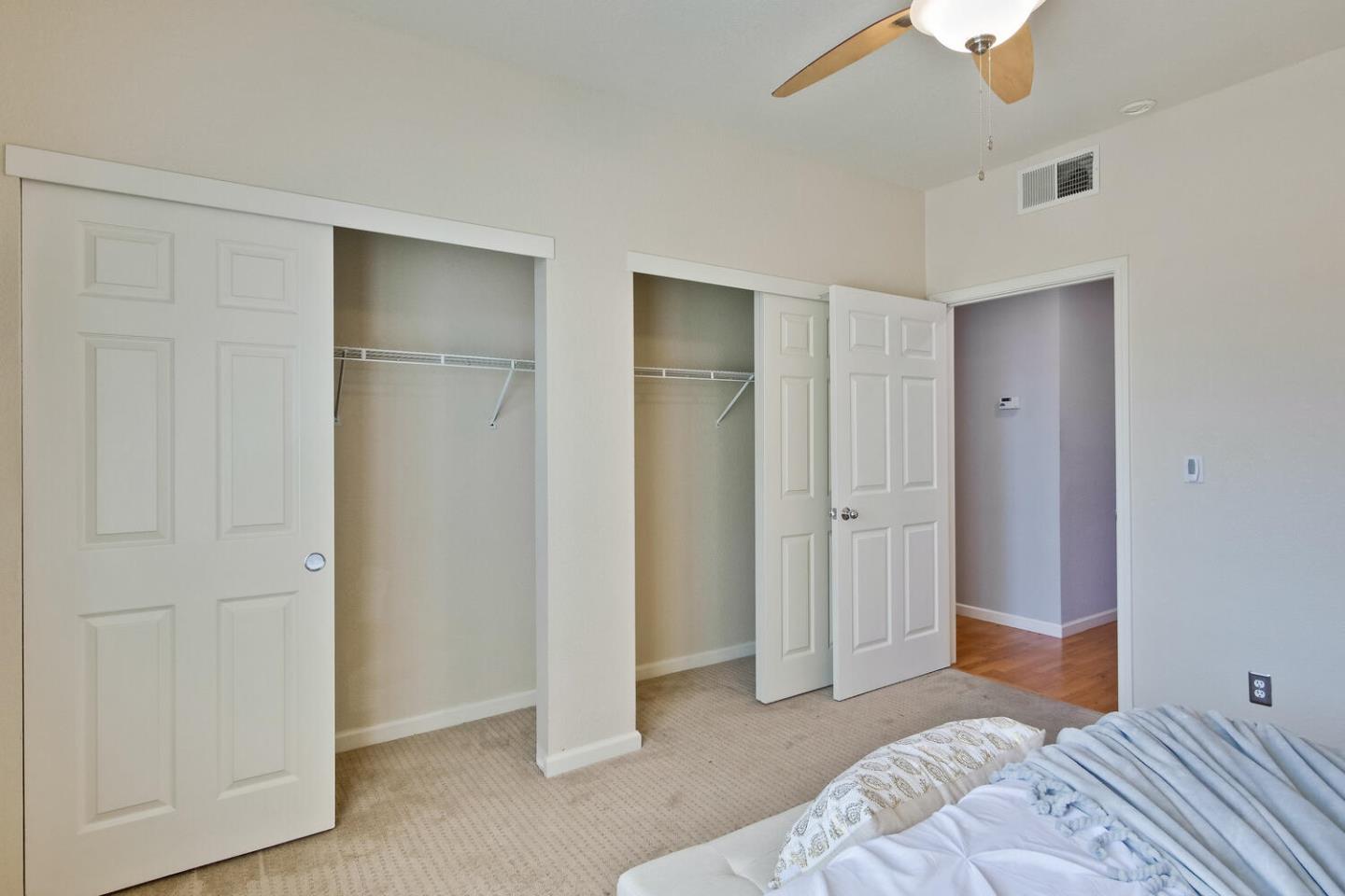 935 Old County Road, Unit 44 Belmont, CA 94002 - Photo 30 of 57 a bedroom with a bed and a closet