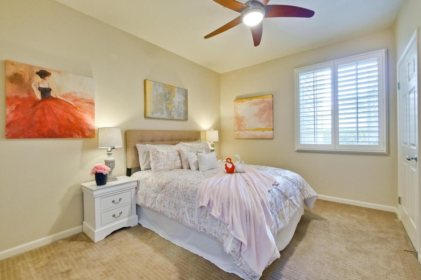 935 Old County Road, Unit 44 Belmont, CA 94002 - Photo 36 of 57 a bedroom with a bed and a chandelier