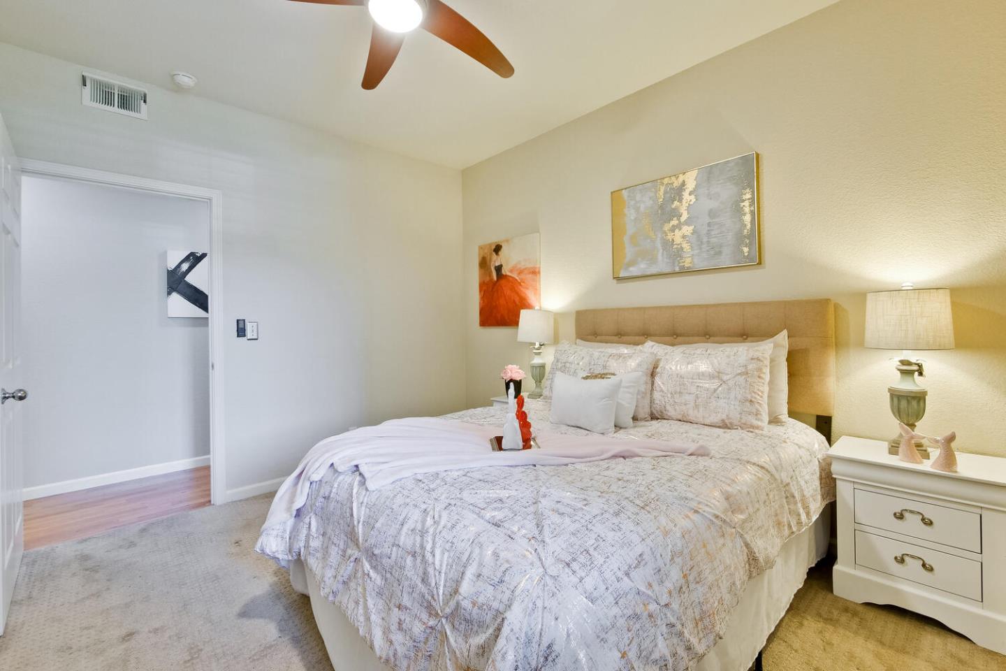 935 Old County Road, Unit 44 Belmont, CA 94002 - Photo 37 of 57 a bedroom with a bed and a painting on the wall