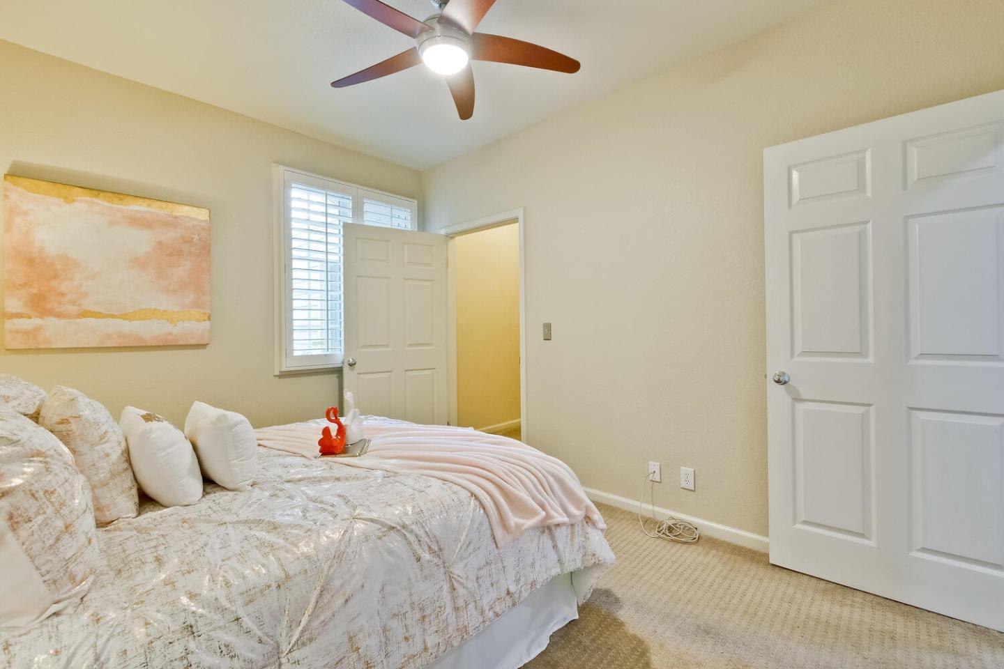 935 Old County Road, Unit 44 Belmont, CA 94002 - Photo 39 of 57 a bedroom with a bed and a chandelier