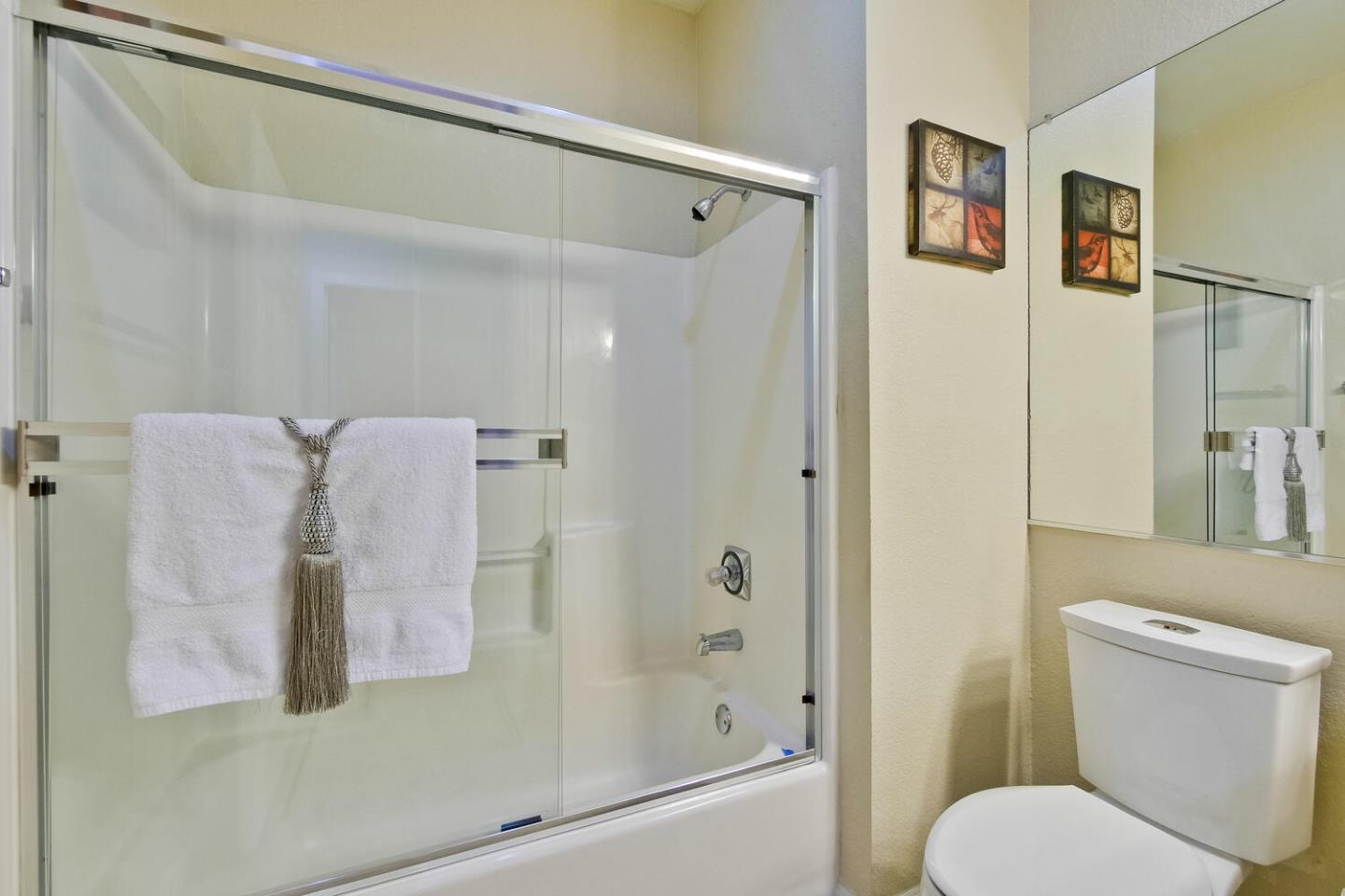 935 Old County Road, Unit 44 Belmont, CA 94002 - Photo 44 of 57 a bathroom with a shower and toilet