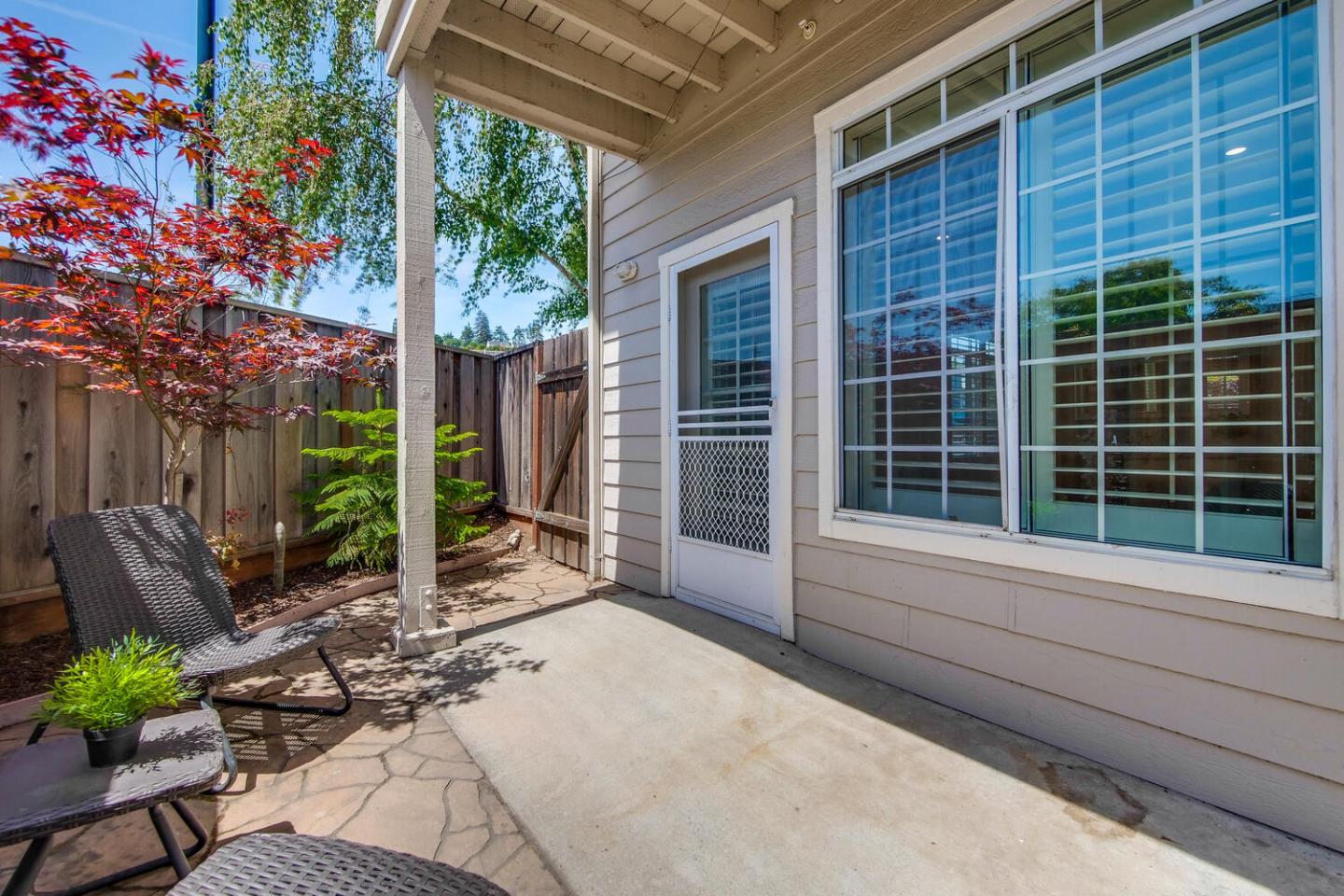 935 Old County Road, Unit 44 Belmont, CA 94002 - Photo 53 of 57 a view of house with backyard outdoor seating and plants