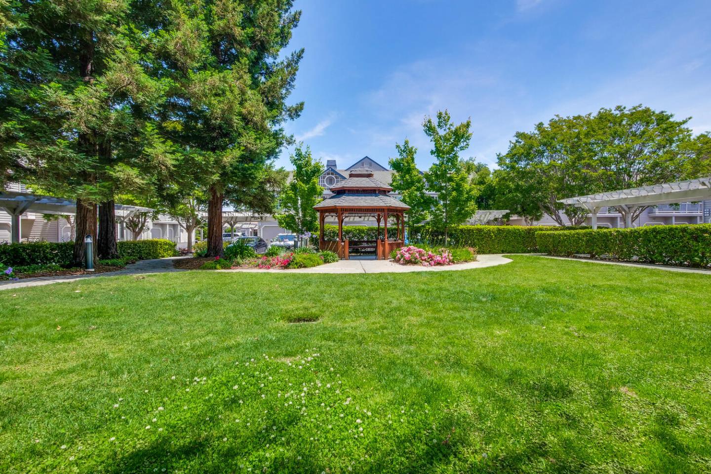 935 Old County Road, Unit 44 Belmont, CA 94002 - Photo 54 of 57 a front view of a house with garden