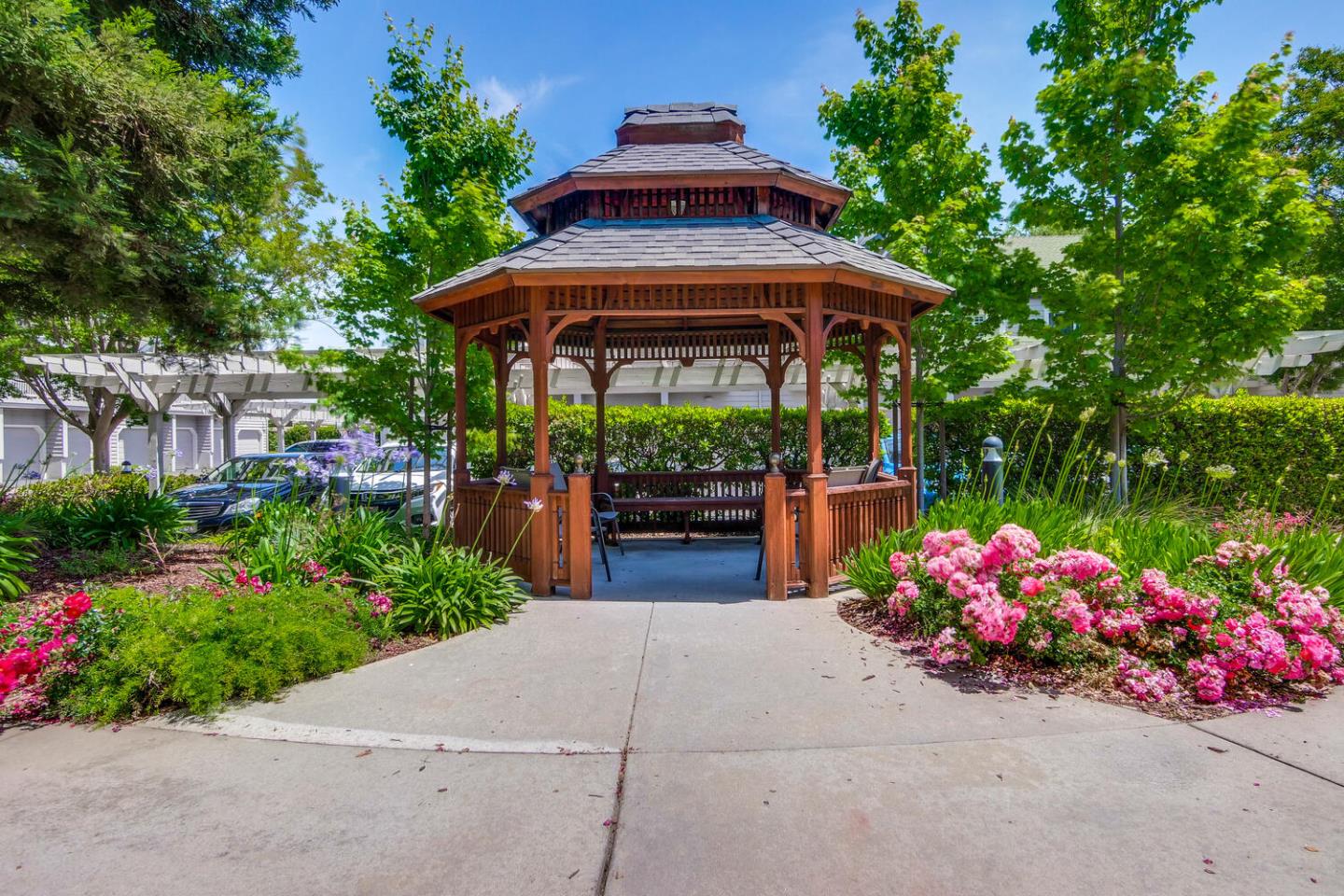 935 Old County Road, Unit 44 Belmont, CA 94002 - Photo 55 of 57 a view of a chairs and tables in the patio with a garden