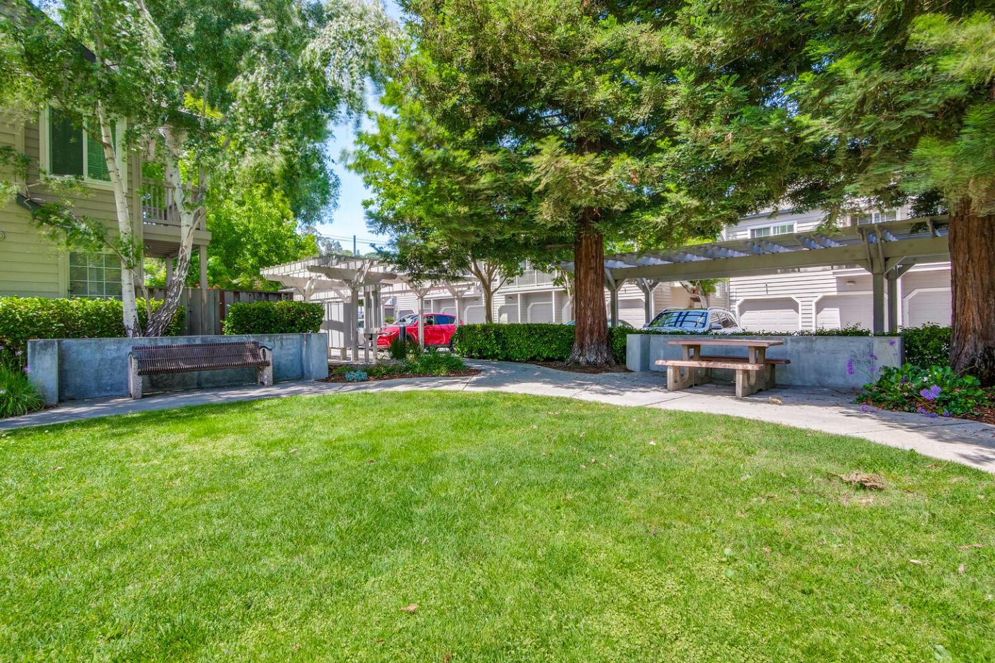 935 Old County Road, Unit 44 Belmont, CA 94002 - Photo 56 of 57 a front view of a house with swing and a big yard