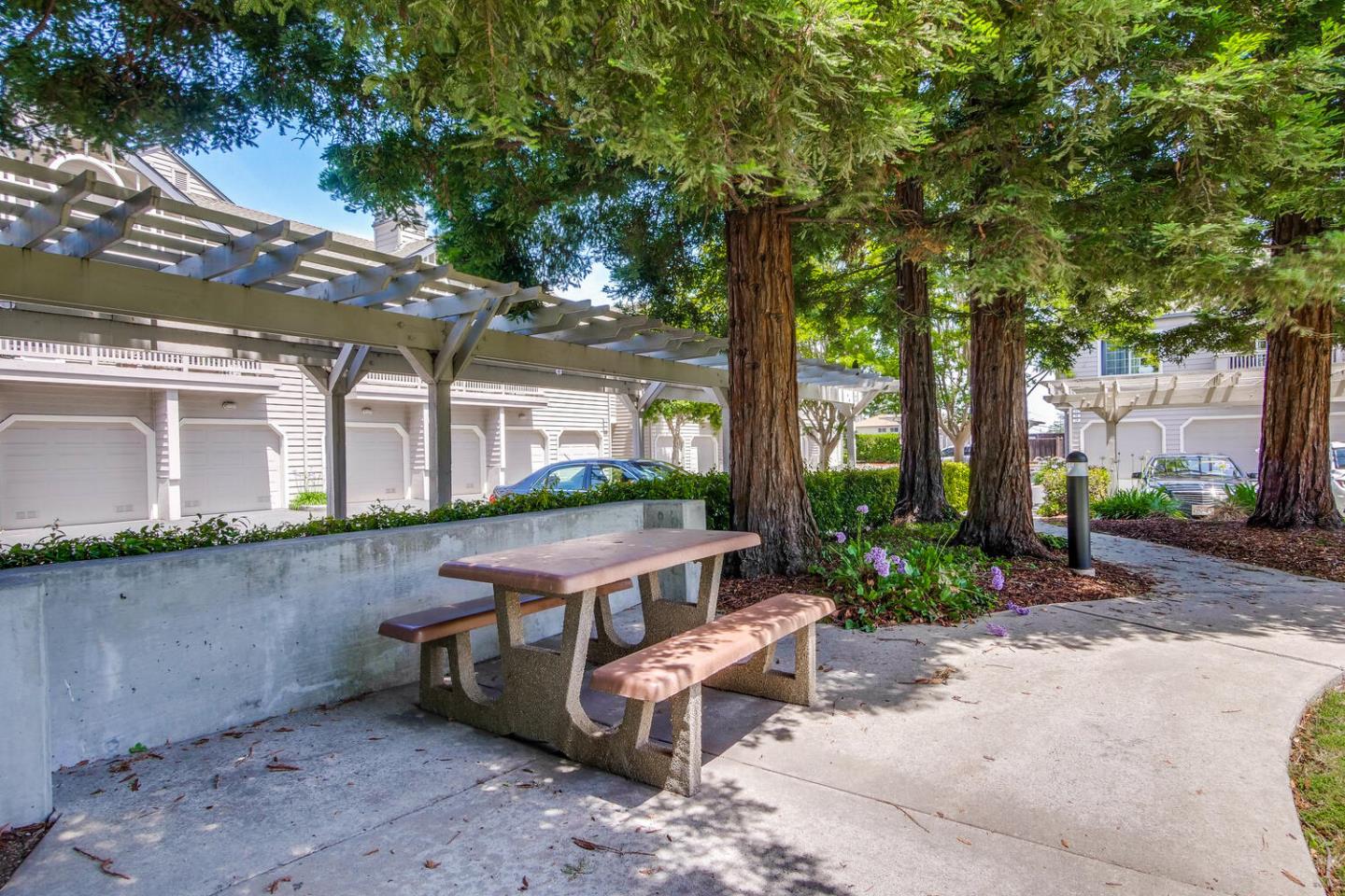 935 Old County Road, Unit 44 Belmont, CA 94002 - Photo 57 of 57 a view of an outdoor sitting area with brick walls