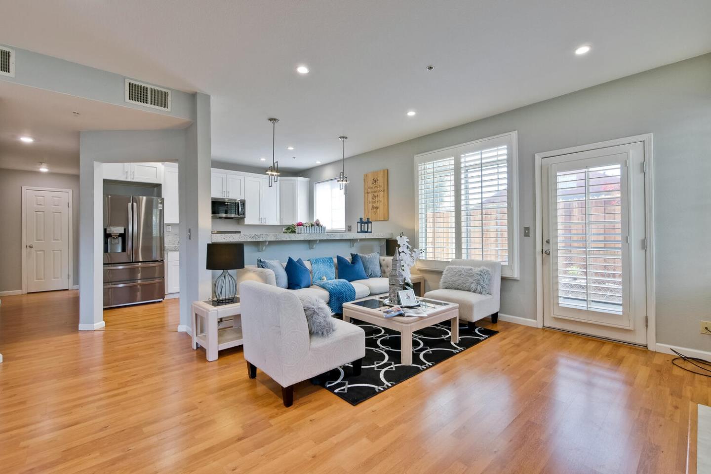 935 Old County Road, Unit 44 Belmont, CA 94002 - Photo 7 of 57 a living room with furniture and a wooden floor