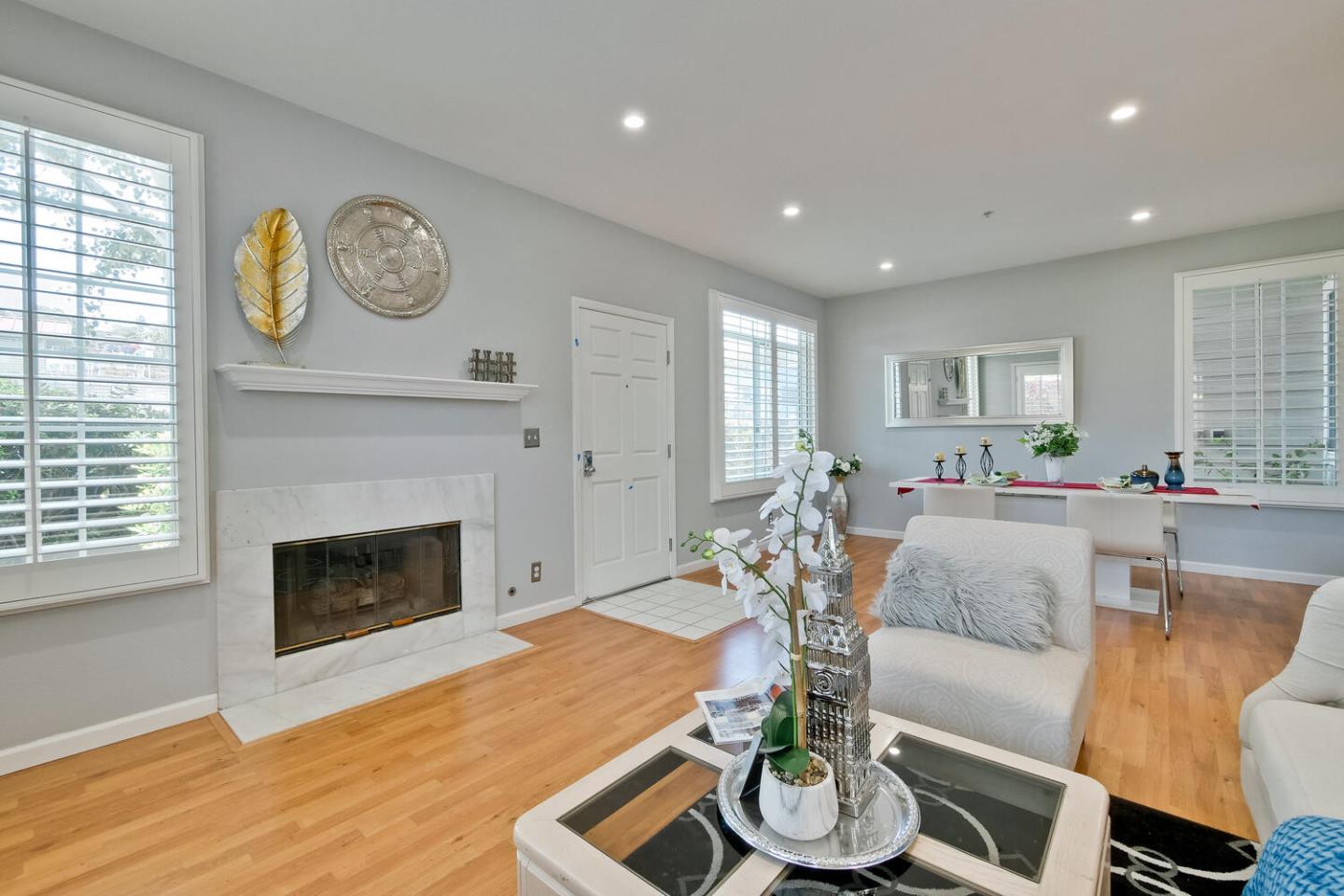 935 Old County Road, Unit 44 Belmont, CA 94002 - Photo 9 of 57 a living room with furniture and a fireplace