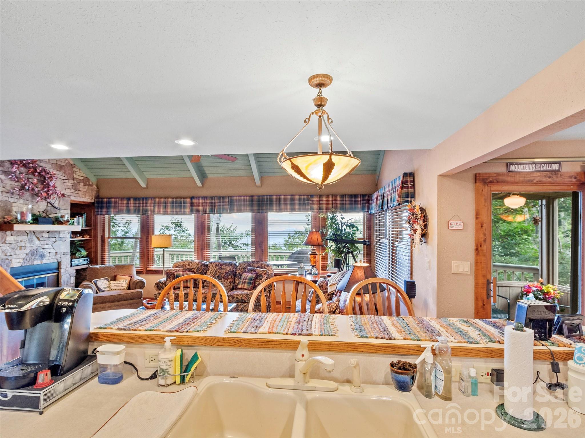 21 Ivy Ridge Road Burnsville, NC 28714 - Photo 12 of 35 a view of a dining room with furniture water and chandelier