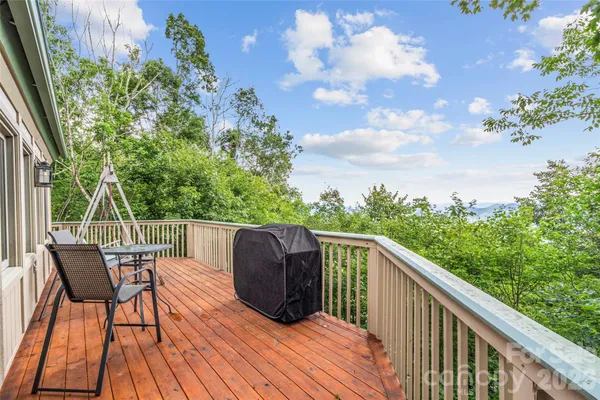 a view of balcony with furniture