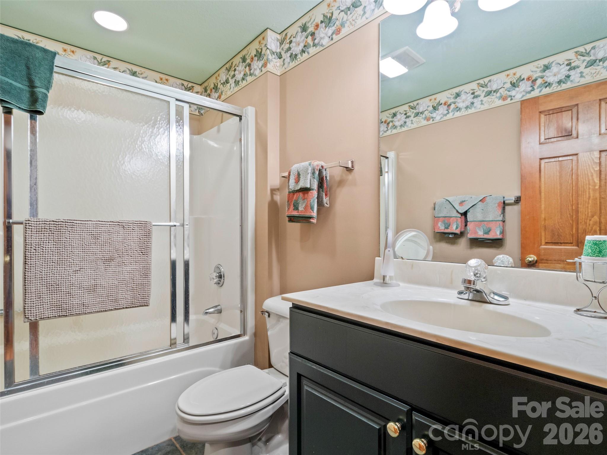21 Ivy Ridge Road Burnsville, NC 28714 - Photo 21 of 35 a bathroom with a sink a toilet and shower