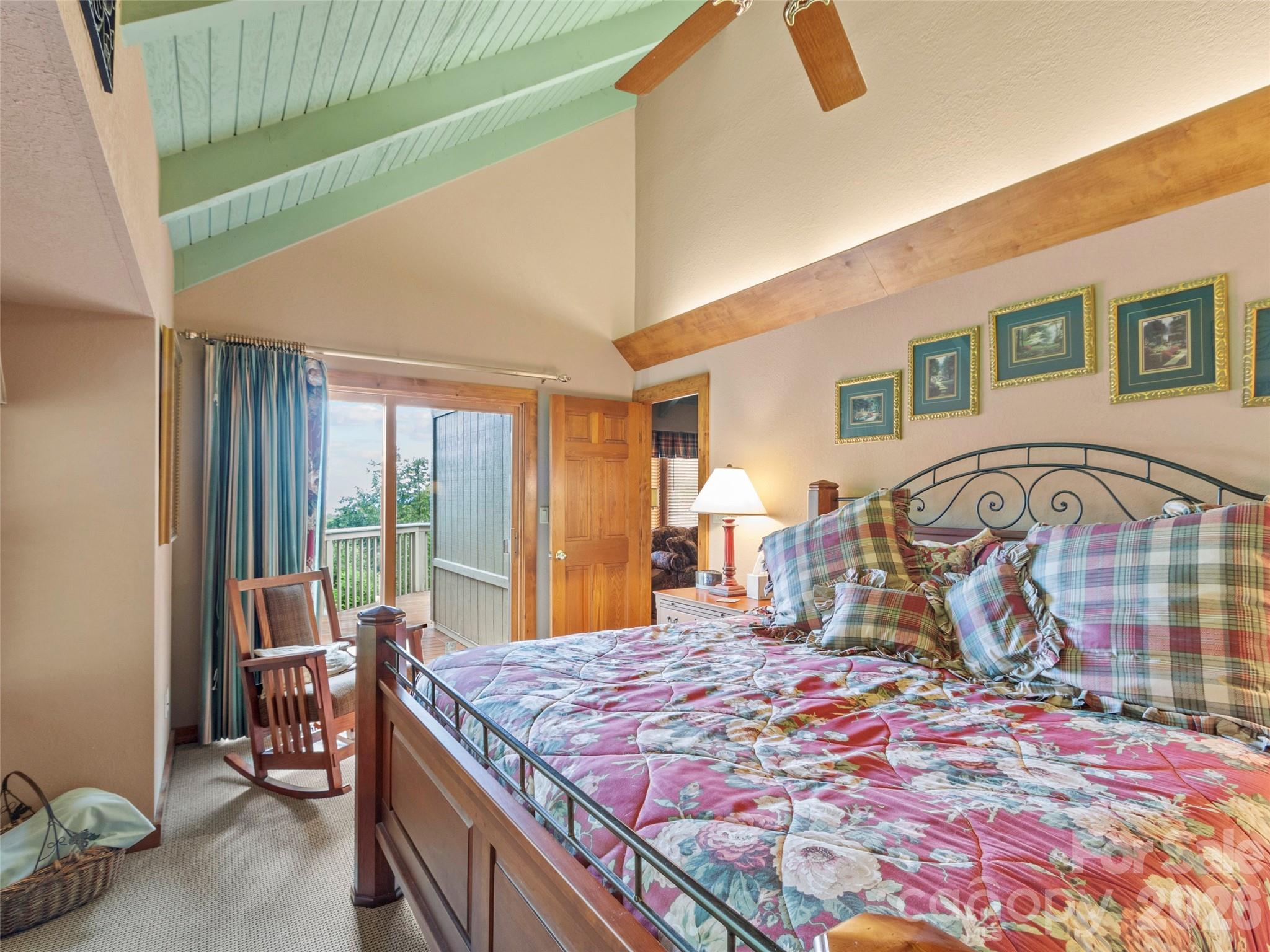 21 Ivy Ridge Road Burnsville, NC 28714 - Photo 26 of 35 a bedroom with a bed and dresser with mirror