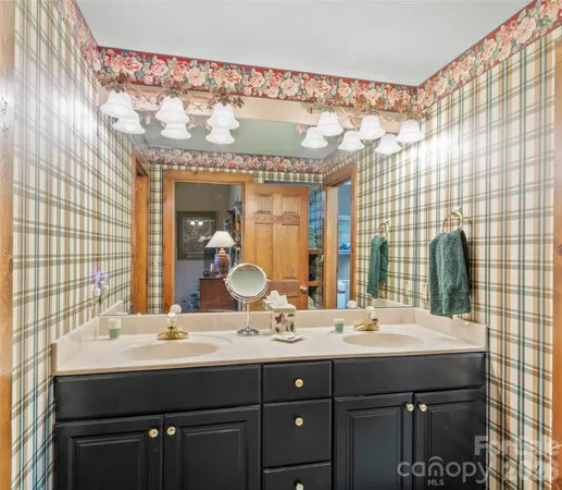 a bathroom with a double vanity sink and a mirror
