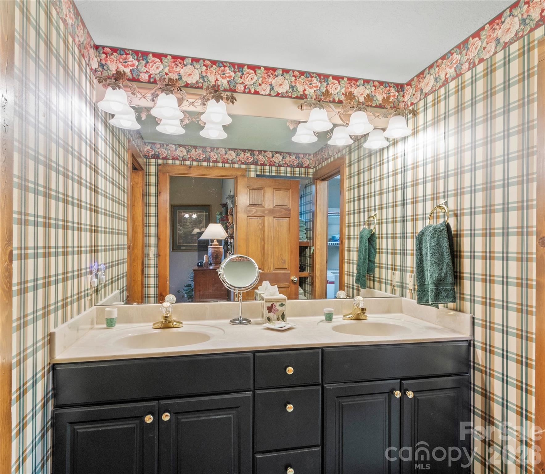 21 Ivy Ridge Road Burnsville, NC 28714 - Photo 27 of 35 a bathroom with a double vanity sink and a mirror