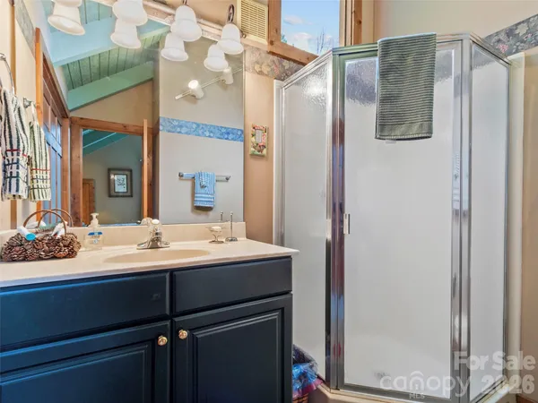 a bathroom with a sink and mirror