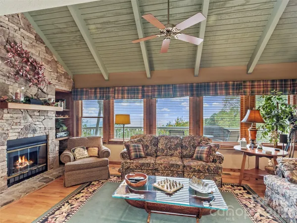 a outdoor living space with furniture and a fireplace