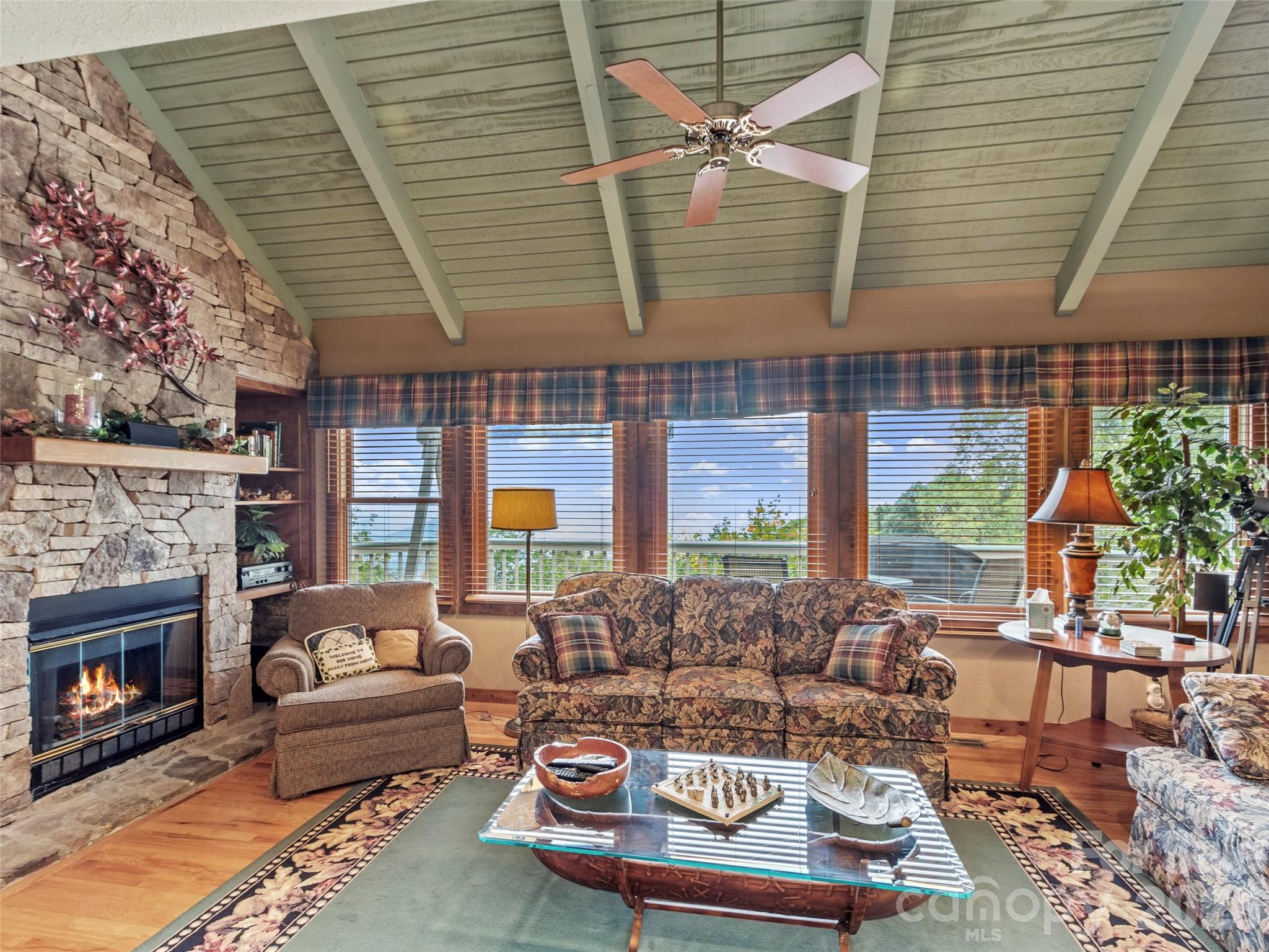 21 Ivy Ridge Road Burnsville, NC 28714 - Photo 4 of 35 a outdoor living space with furniture and a fireplace
