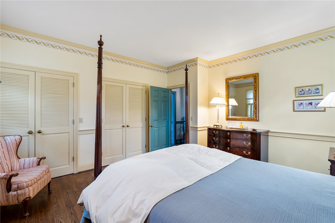 401 Berkshire Hill Anderson, SC 29621 - Photo 19 of 39 This spacious bedroom features classic design elements and rich hardwood flooring, perfect for serene relaxation.