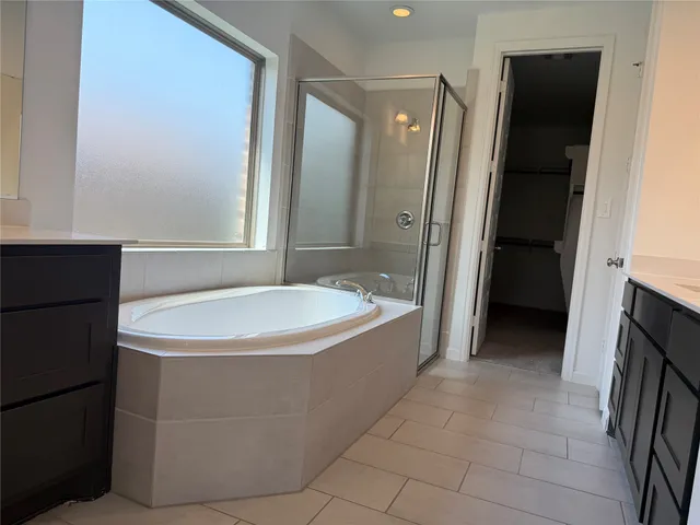 a bathroom with a bathtub and a sink