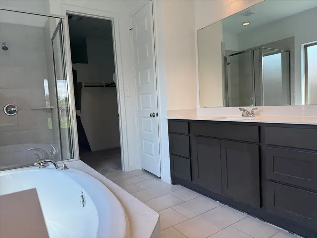 a en suite bathroom with a sink and mirror