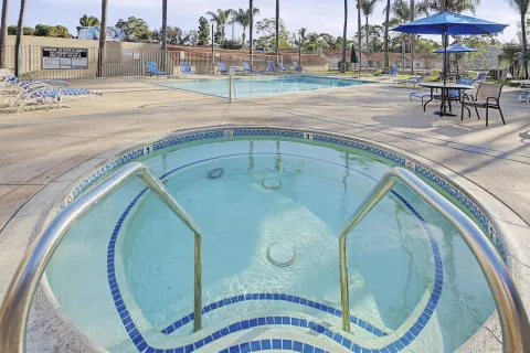 a view of swimming pool with outdoor seating